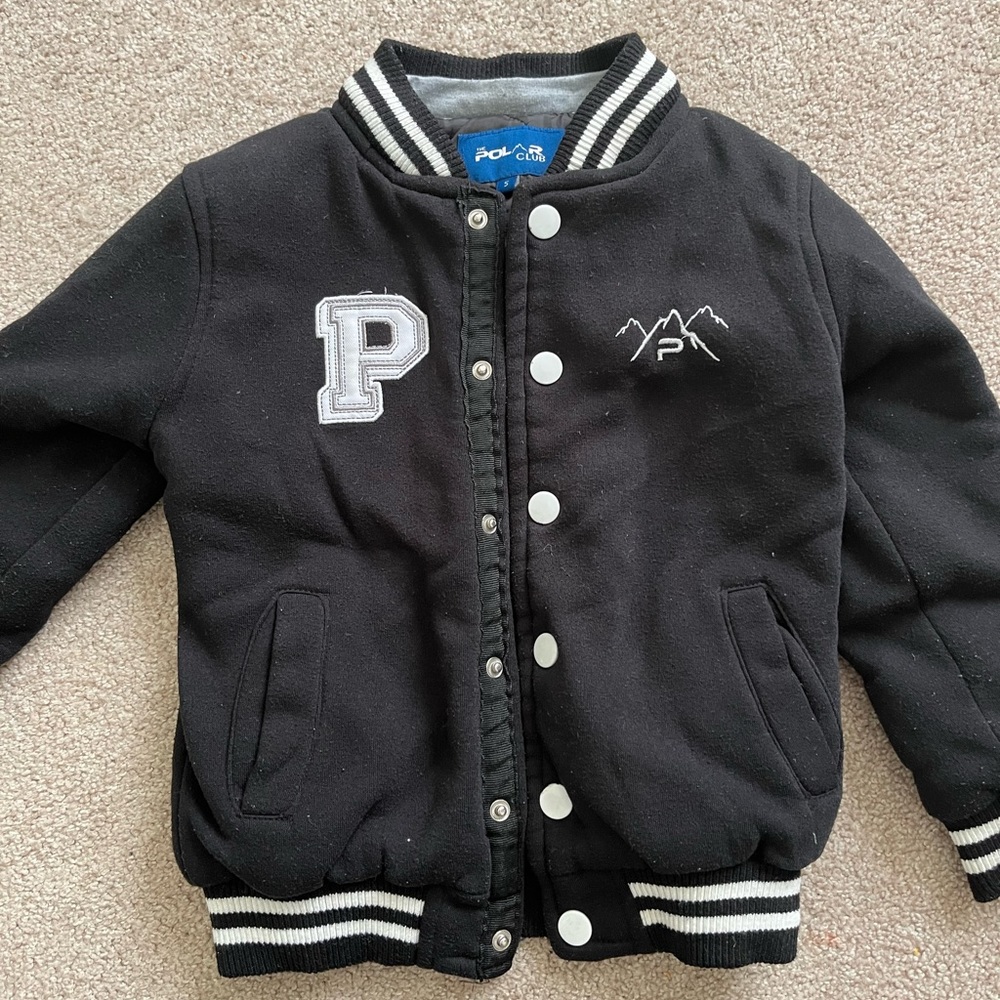 Black varsity jacket- very warm. Layered. Thick